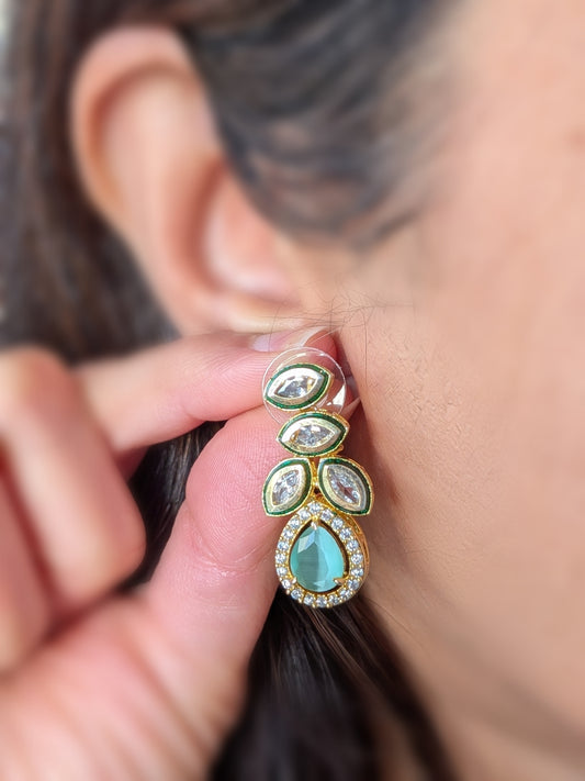 Golden earrings with Kundan and AD in mint green